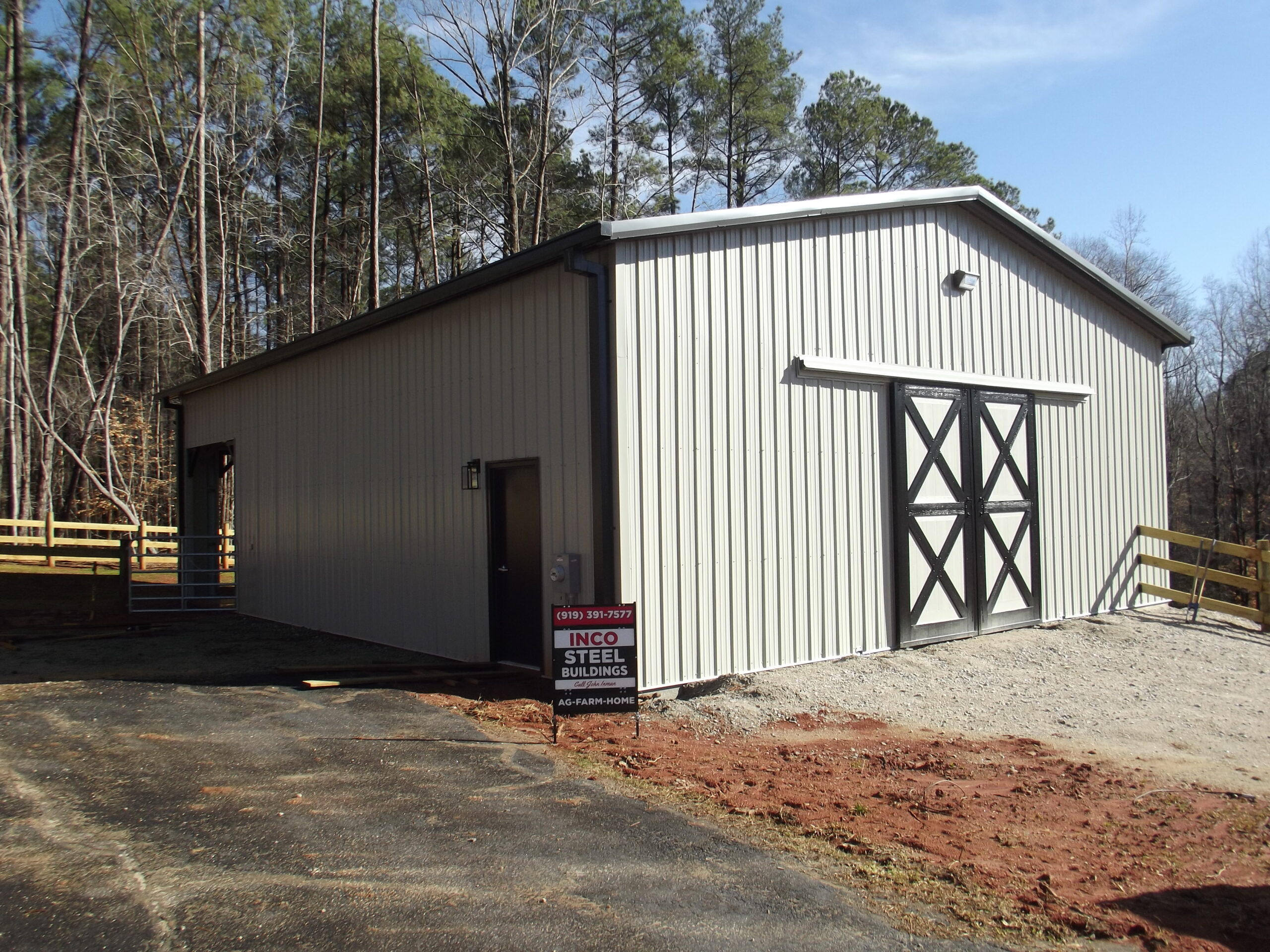 Completed Metal Sales Building System hose stable farm steel building with custom weather tight trim packages in Wake Forest NC built by Inco Steel Buildings.